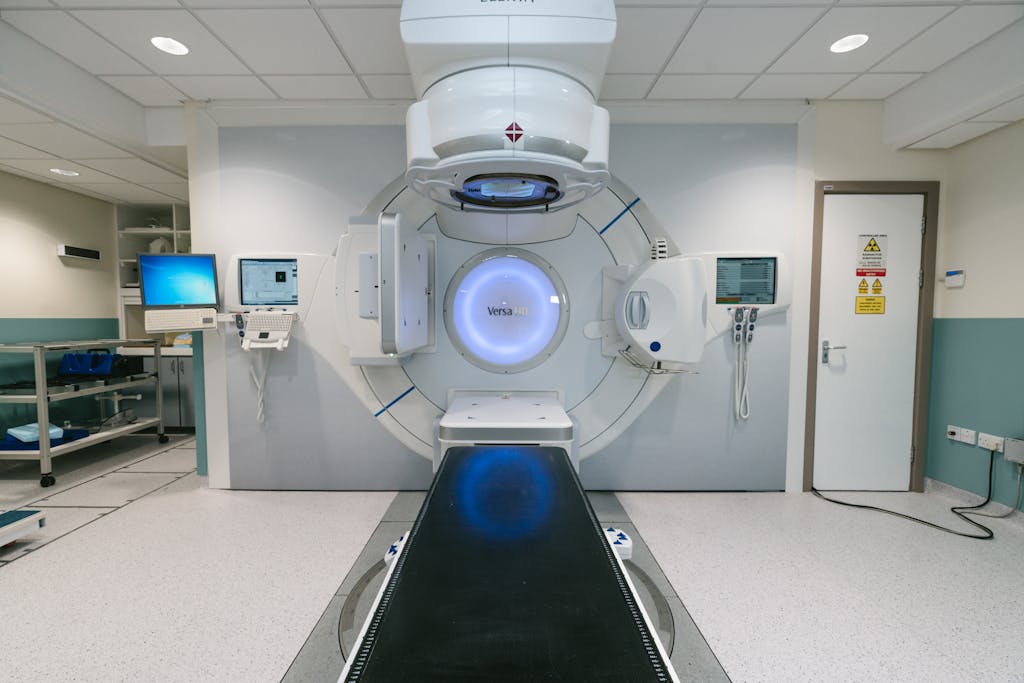 A modern radiotherapy machine in a hospital setting used for cancer treatment.